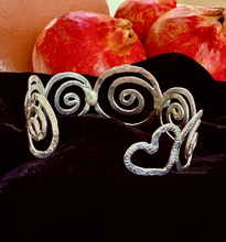 Sterling silver handmade cuff bracelet , spirals, heart, rose cut garnet, rose cut amethyst, pomegranates in the background