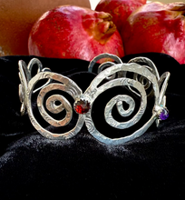 handmade sterling silver cuff bracelet with pomegranates in the background