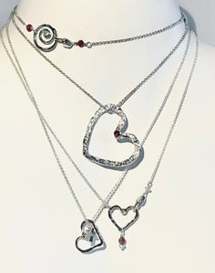 Hefty Open Floating Heart in sterling silver with Rhodolite Garnet & Rubies